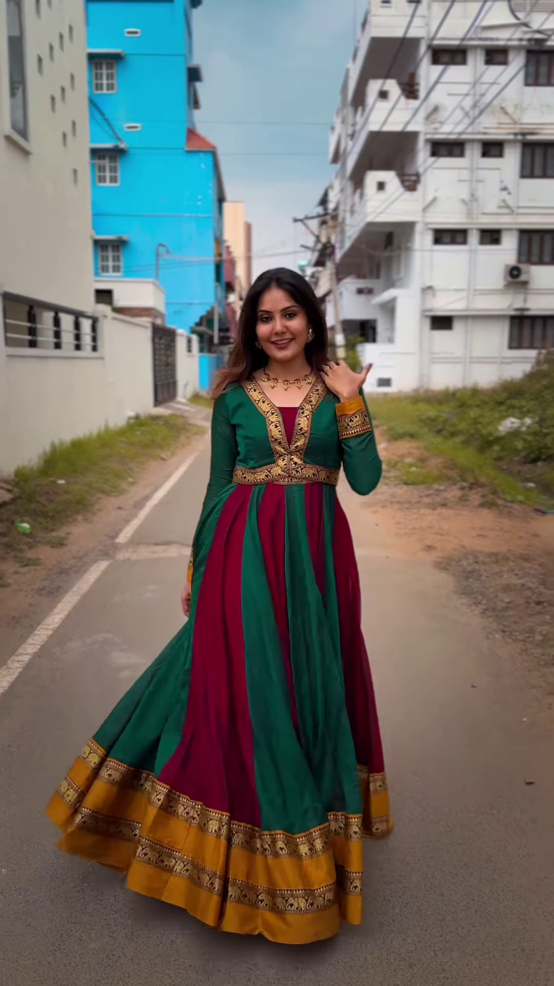Regal Green & Maroon Anarkali Suit with Gold Zari Embellishments